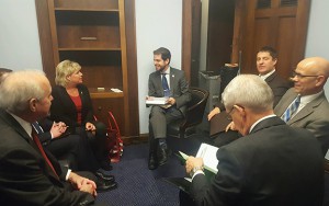 Kyle Kunkler (center), a legislative assistant to Rep. Dan Newhouse (R-Wash.), met with the Washington group.