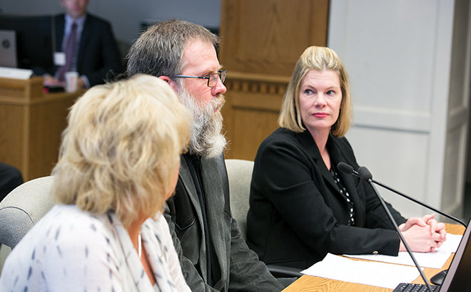Benton County wheat grower Chad Smith (center) testifies in front of the Washington State Senate’s Agriculture, Water, Trade and Economic Development Committee during a public hearing on SB 5051, a bill relating to nondefault termination provisions in state land leases for agricultural or grazing purposes. Looking on are Washington Association of Wheat Growers Lobbyist Diana Carlen (right) and Benton County grower Nicole Berg. Photo courtesy of the Washington State Legislative Support Services.