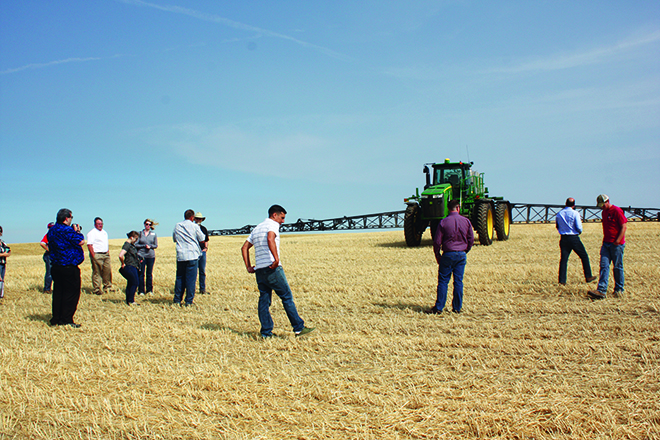 The first stop was at Green View Farms to introduce the group to the equipment that is used to grow and harvest wheat, included this spray tractor.
