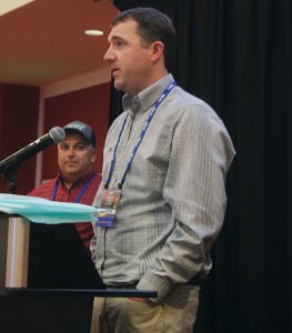 Dan Schmitz (right) of Rosalia, Wash., accepts the county of the year award for Spokane County at the Washington awards banquet, held during the 2017 Tri-State Grain Growers convention, while David DeGon from Fairfield, Wash., looks on.