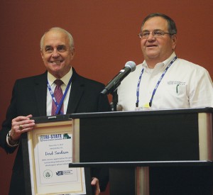 Outgoing Washington Association of Wheat Growers’ (WAWG) president, Ben Adams (right), along with the Washington Grain Commission, presented a thank-you gift to Derek Sandison, director of the Washington State Department of Agriculture, for all his work for the wheat industry advocating for more research into falling numbers.